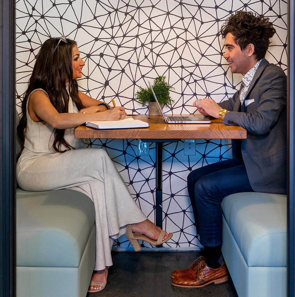 Two friends working at a table