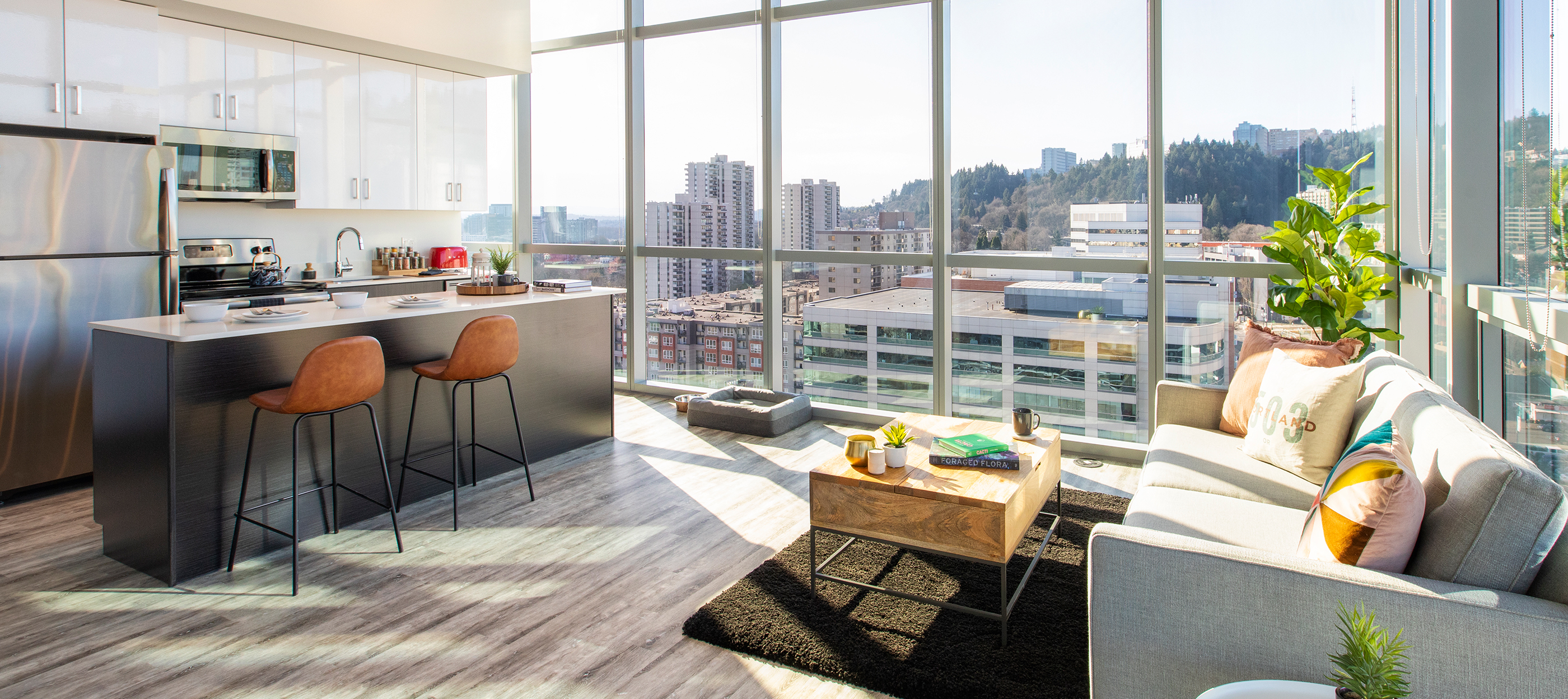 A furnished living room and fully-equipped kitchen