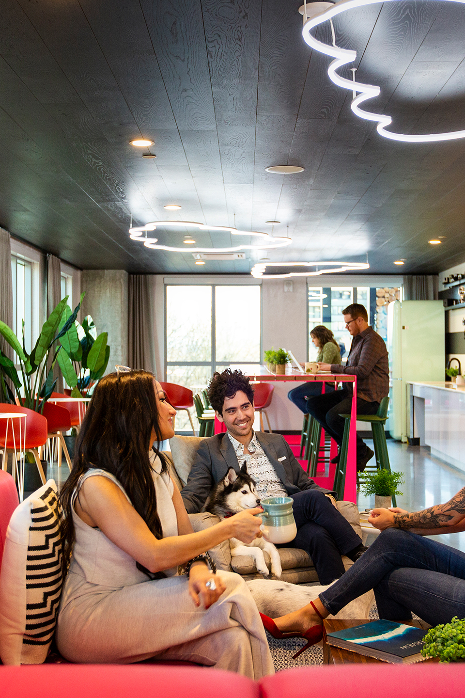 A group of friends talking and sitting on a couch